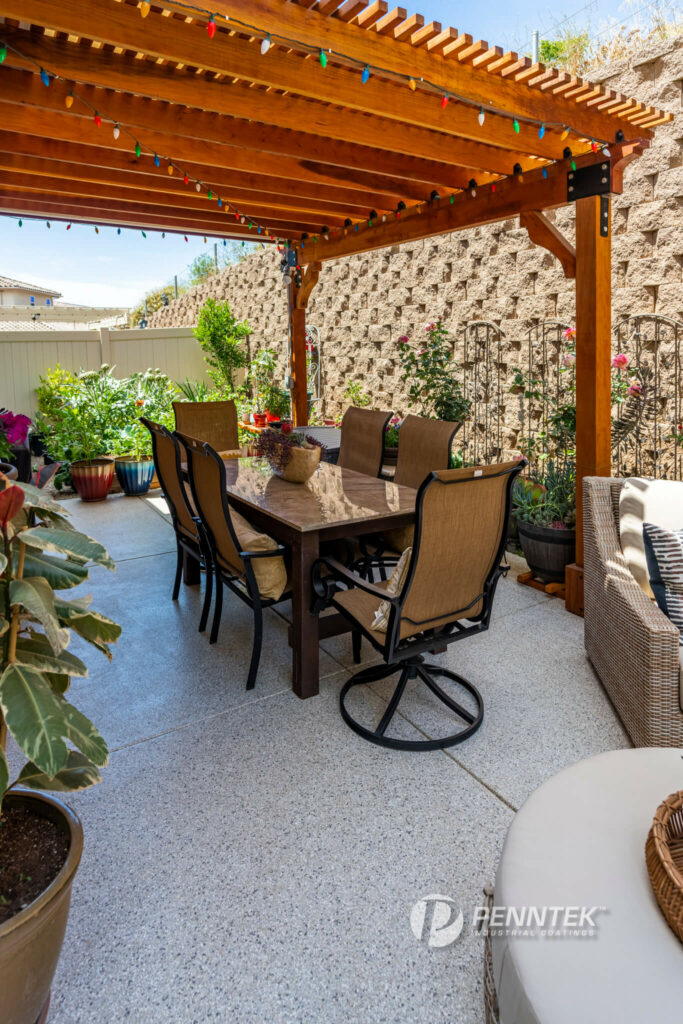 penntek patio fully furnished with plants and table and chairs