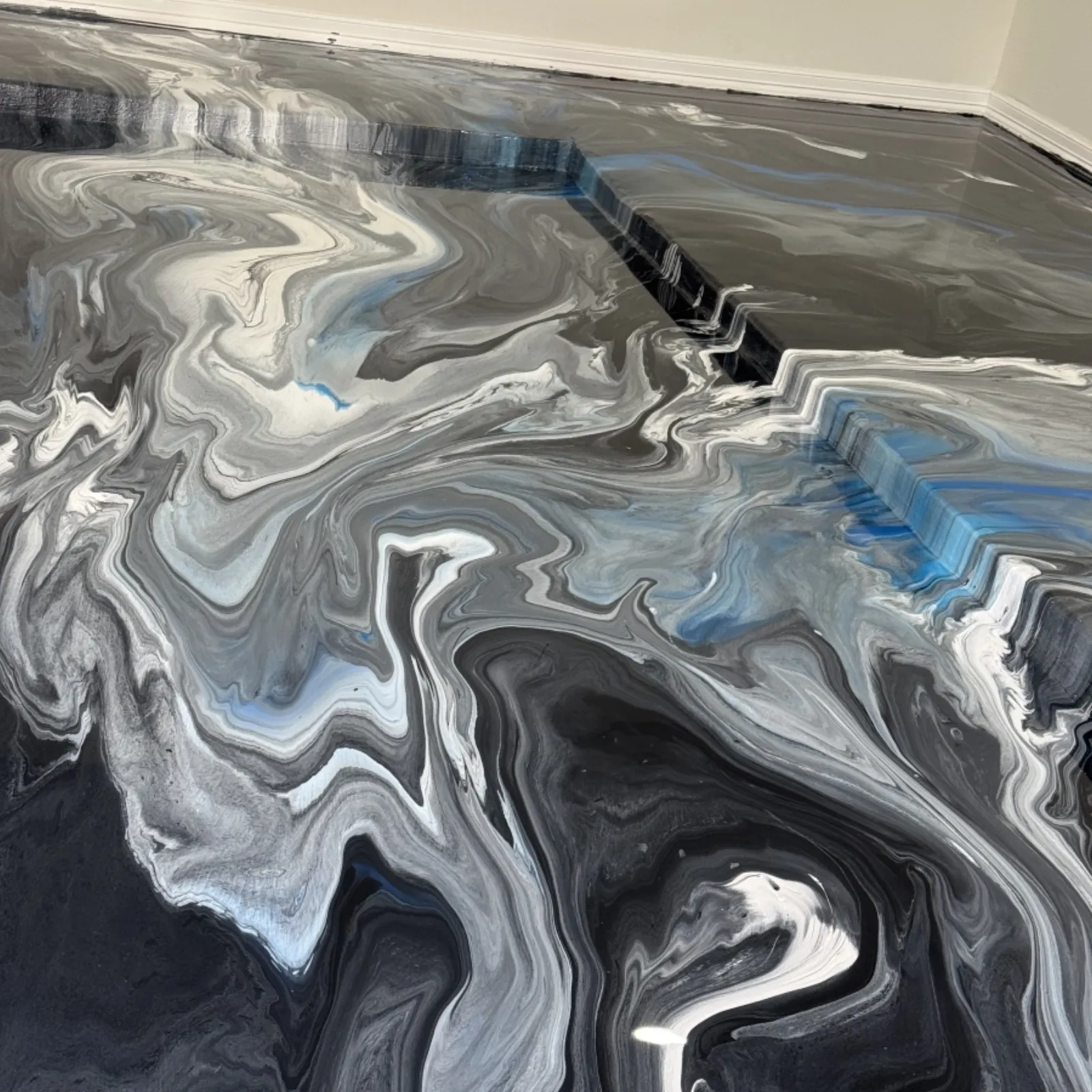 Residential epoxy floor project photographed after completion by Elite Coatings