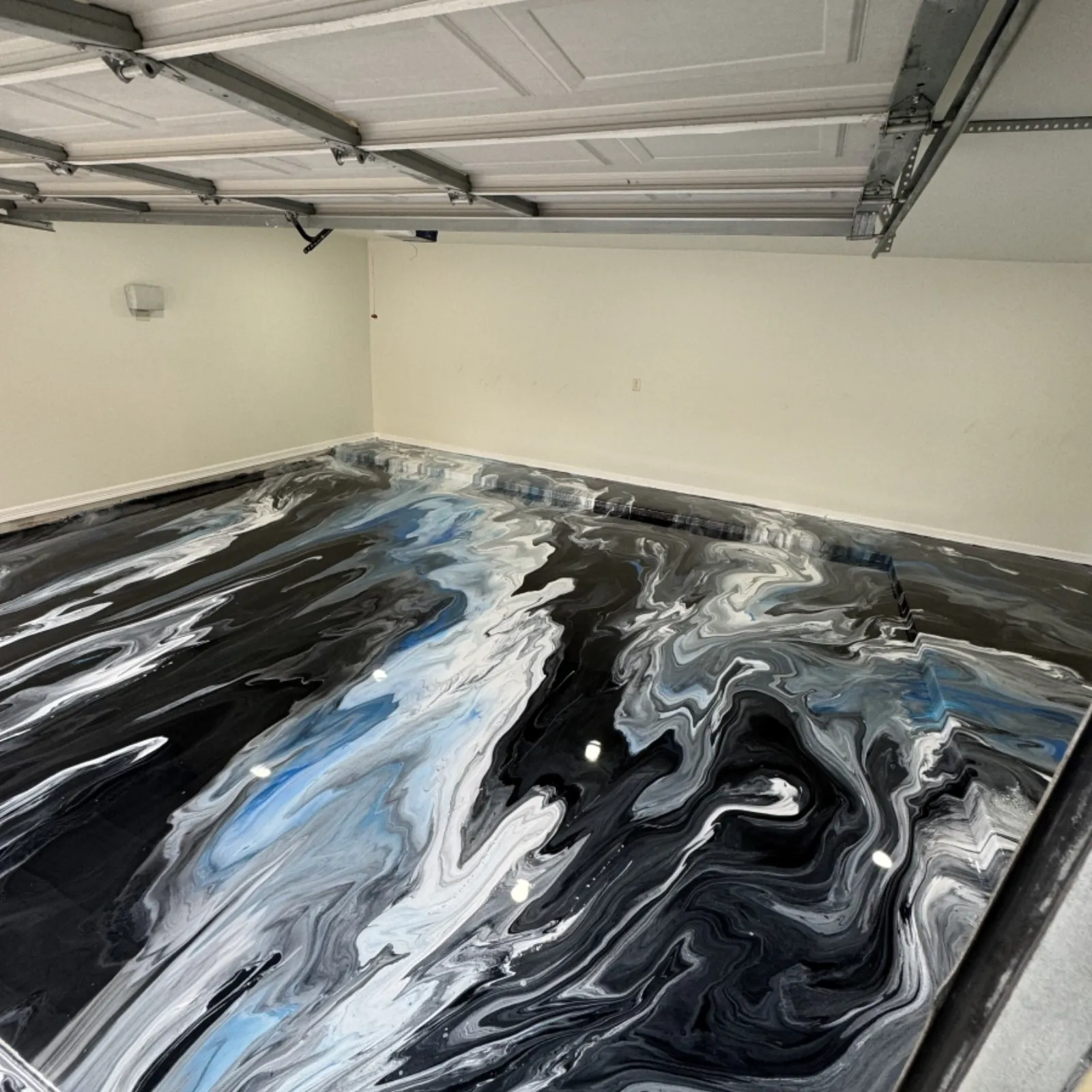 Close-up of flake chip broadcast epoxy finish in a South Houston garage